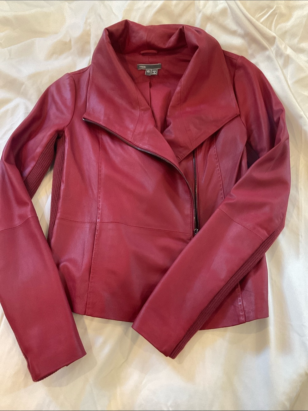 Rich red leather jacket. Soft and buttery. Nearly new with no signs of wear.